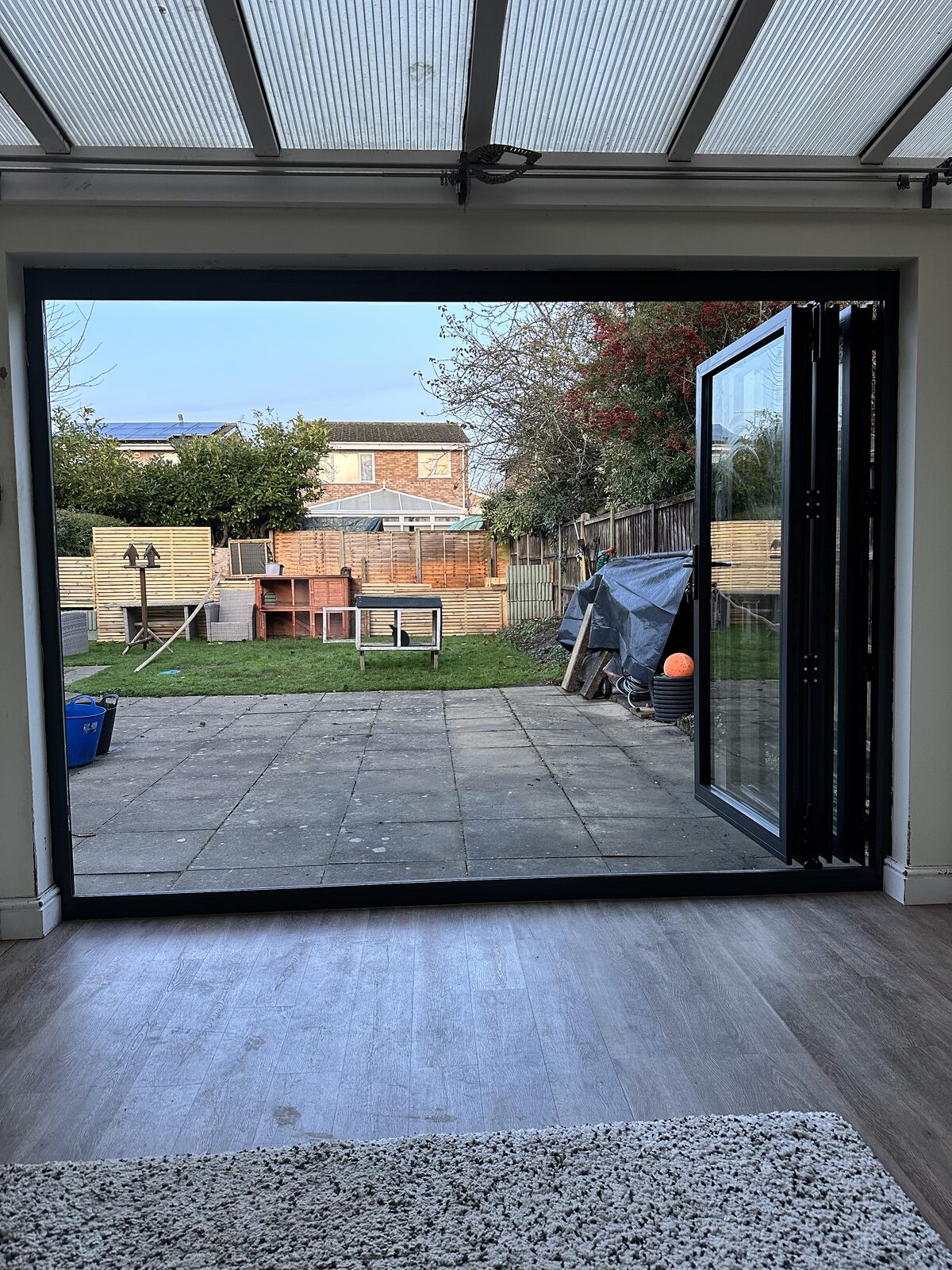 Aluminium bi-fold doors opening to the garden