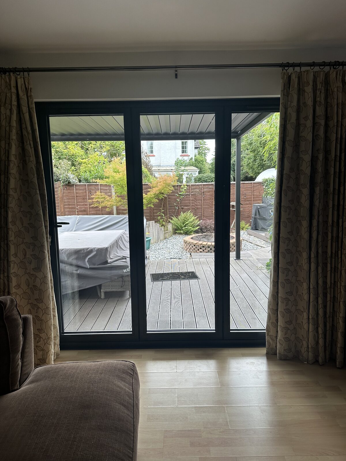 Aluminium bi-fold doors with a garden view
