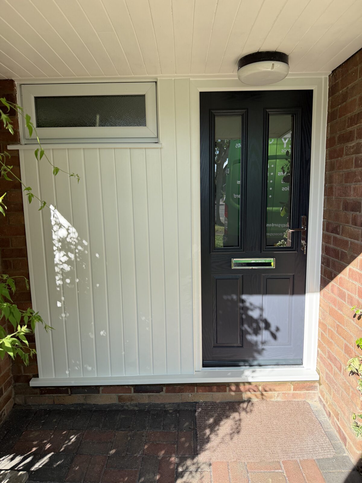 Grey composite door with side panel